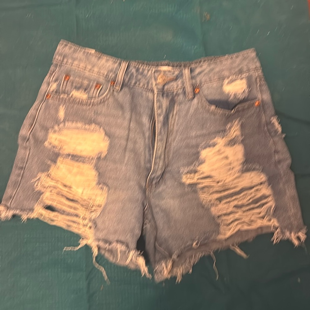Ripped blue jean shorts